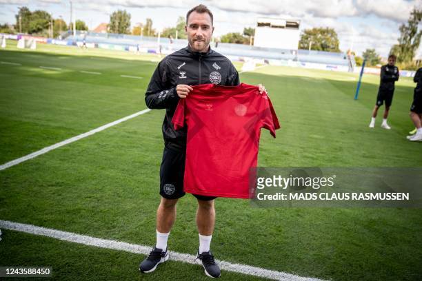 This picture taken on September 19, 2022 in Helsingborg, Denmark, shows Christian Eriksen, player of Denmark's national football team, wearing a...