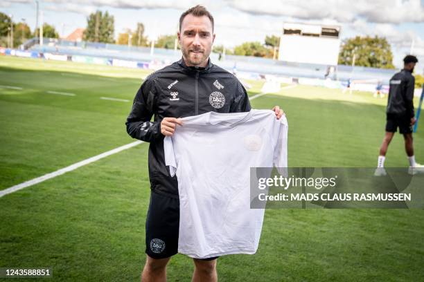 This picture taken on September 19, 2022 in Helsingborg, Denmark, shows Christian Eriksen, player of Denmark's national football team, wearing a...