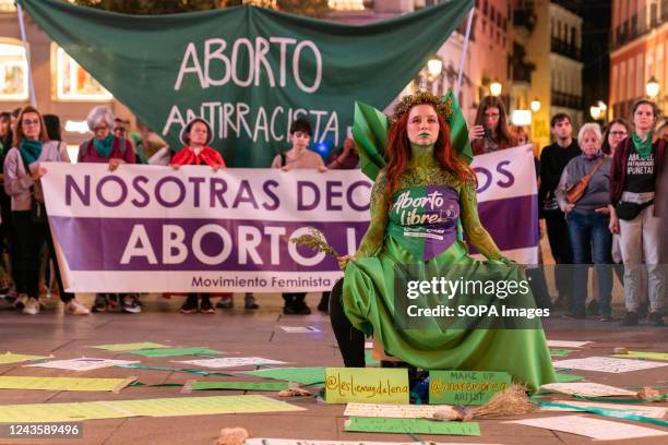 Woman in the center of a circle performs during the final act of the demonstration. On 28th September, demonstrators gathered for the Global day of...