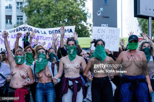 Topless women march through the Streets while holding hands during the demonstration at the Justice Ministry entrance. On 28th September,...