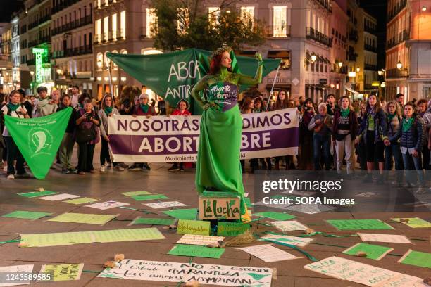 Woman in the center of a circle performs during the final act of the demonstration. On 28th September, demonstrators gathered for the Global day of...