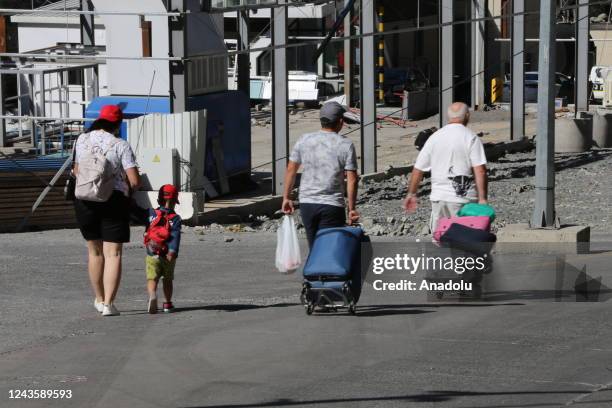 Russians are seen attempting to leave their country to avoid a military call-up for the Russia-Ukraine war as queues have formed at the Kazbegi...