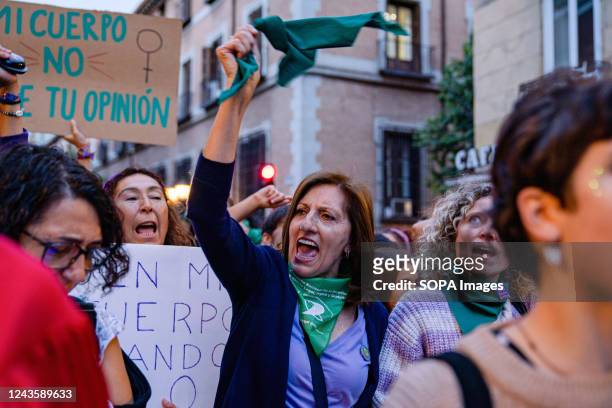 Woman waves a green handkerchief while chanting slogans during the demonstration. On 28th September, demonstrators gathered for the Global day of...