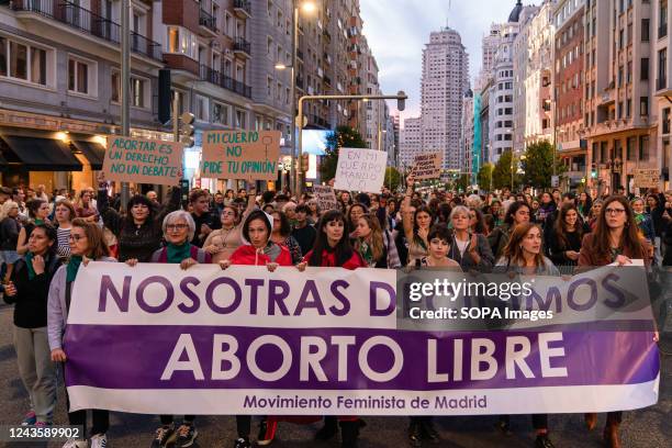 Women hold placards and a banner expressing their opinions during the demonstration. On 28th September, demonstrators gathered for the Global day of...