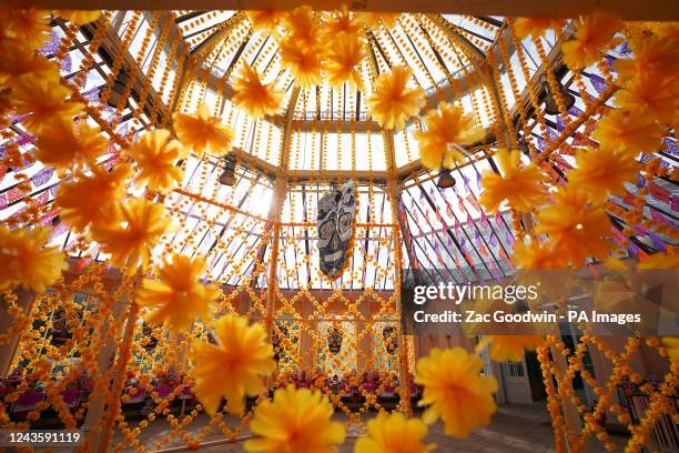 An installation titled Una Ofrenda Floreciendo en su Mmemoria by Betsabee Romero is seen in Kew Gardens' Temperate House, the world's largest...