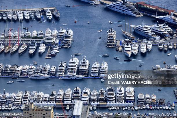 Photograph shows moored yachts at the Hercules Port in Monaco during the 31st edition of the International Monaco Yacht Show on September 29, 2022. -...