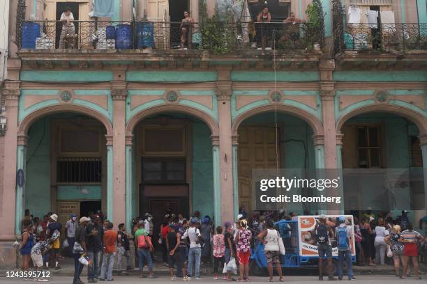 Customers wait in line to purchase bread in Havana, Cuba, on Wednesday, Sept. 28, 2022. Cuban officials said they had begun to restore some power...