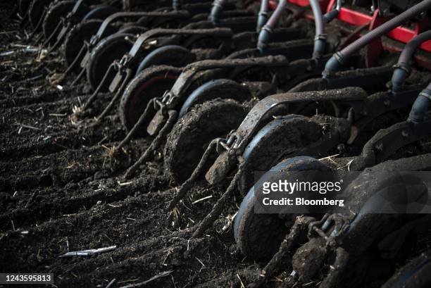 Seed coulters cut through the earth during the sowing of the winter wheat crop at a farm in Flora village, Odesa Oblast, Ukraine, on Wednesday, Sept....