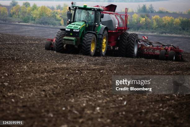 Tractor pulls a seed drill during the sowing of the winter wheat crop at a farm in Flora village, Odesa Oblast, Ukraine, on Wednesday, Sept. 28,...