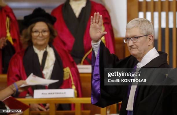 Apple Chief Executive Officer Tim Cook reacts after receiving an honorary degree in Innovation and International Management at Federico II University...