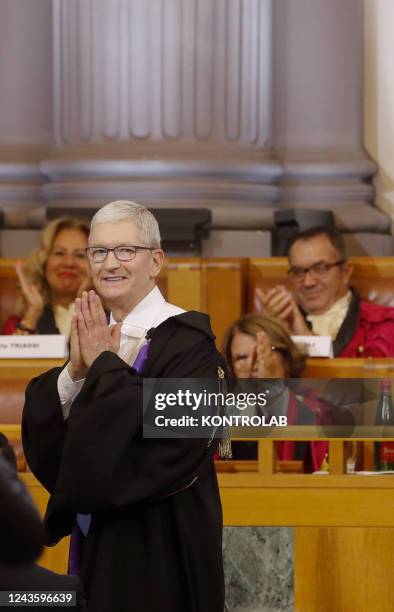 Apple Chief Executive Officer Tim Cook reacts after receiving an honorary degree in Innovation and International Management at Federico II University...