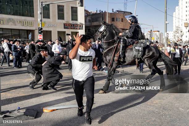 Israeli mounted police forces attempt to disperse a protest by members of the ultra-Orthodox Jewish community against their conscription in the...
