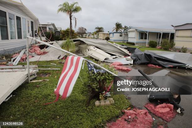 Debris litters a mobile home park in Fort Myers, Florida, on September 29 one day after Hurricane Ian made landfall. - Hurricane Ian inundated...