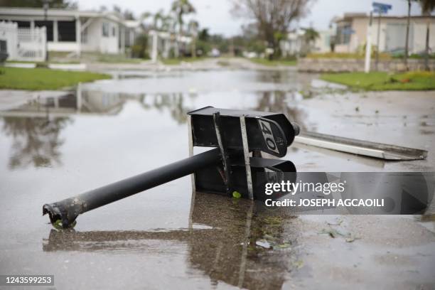 Debris litters a mobile home park in Fort Myers, Florida, on September 29 one day after Hurricane Ian made landfall. - Hurricane Ian inundated...