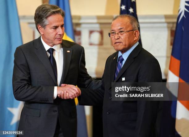 Secretary of State Antony Blinken shakes hands with Marshall Islands' President David Kabua at the State Department in Washington, DC, September 29,...