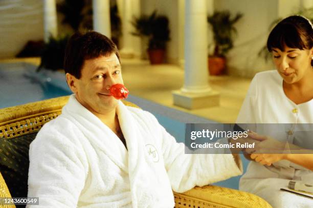 Alan Titchmarsh introduces the documentary Naked Red Nose Ground Force in Practice, shown in the run up to Red Nose Day 2001, from his home.