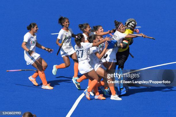 India celebrate together after winning the penalty shoot out after the women's bronze medal match between India and New Zealand on day ten of the...