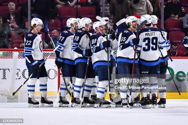 The Winnipeg Jets celebrate their victory against the Montreal Canadiens at Centre Bell on September 29, 2022 in Montreal, Quebec, Canada. The...