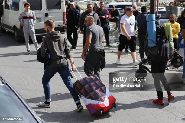 Russians are seen attempting to leave their country to avoid a military call-up for the Russia-Ukraine war as queues have formed at the Kazbegi...