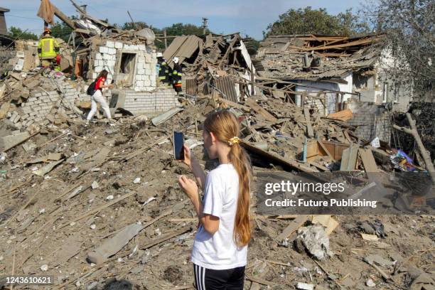 Girl captures the consequences of an overnight Russian missile attack with a smartphone in a residential area in Dnipro, central Ukraine. As...