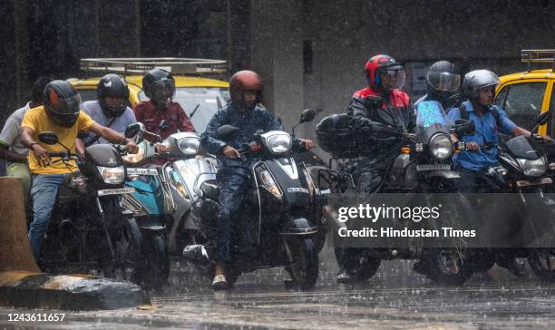 Motorists drive through a brief spell of rainfall, at Shivaji Park, Dadar, on September 29, 2022 in Mumbai, India.