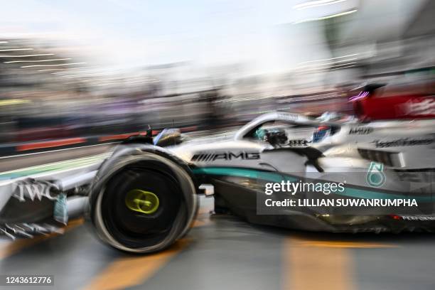 Mercedes' British driver George Russell leaves the pit lane during the first practice session ahead of the Formula One Singapore Grand Prix night...