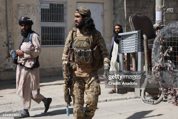 Security forces stand guard after a suicide bomb attack on an education institute in Kabul, Afghanistan on September 30, 2022. A suicide bomber blew...