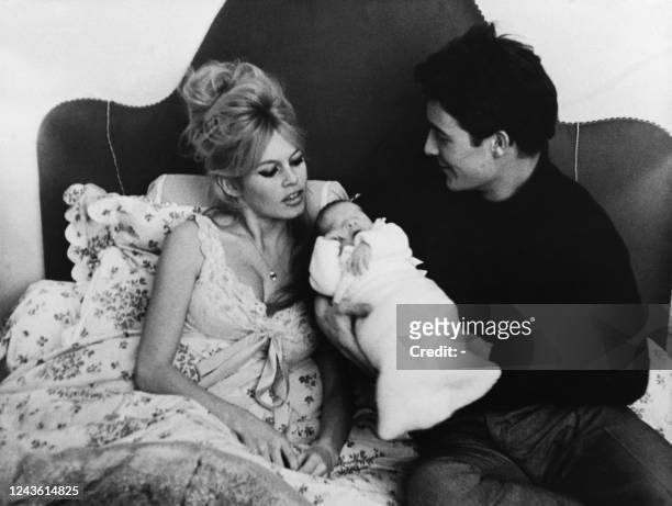Picture taken on January 13, 1960 shows French actress Brigitte Bardot and her husband Jacques Charrier with their son Nicolas born on January 11th...