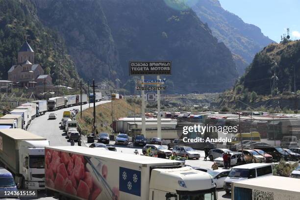 Russians are seen attempting to leave their country to avoid a military call-up for the Russia-Ukraine war as queues have formed at the Kazbegi...