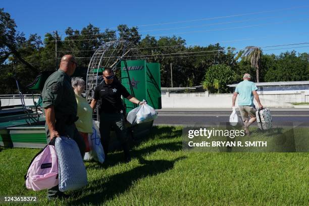 Osceloa County Sheriffs use a fanboat to rescue residents from flooding following Hurricane Ian on September 30, 2022 in Kissimmee, Florida. -...