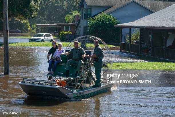 Osceloa County Sheriffs use a fanboat to rescue a 93 year-old resident from flooding following Hurricane Ian on September 30, 2022 in Kissimmee,...