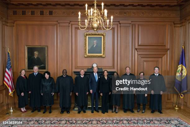 In this handout provided by the Collection of the Supreme Court of the United States, Members of the Supreme Court with the President Associate...