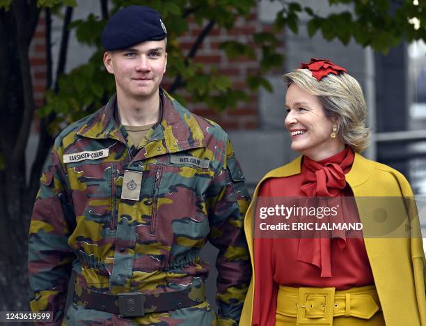 Queen Mathilde of Belgium looks at Prince Gabriel as they attend the Blue Berets parade held by first-year students of the Royal Military Academy,...