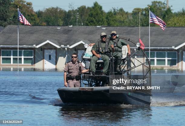 Osceola County Sheriffs use a fanboat as they urge residents to leave the flooded Good Samaritan Society Village, following Hurricane Ian on...