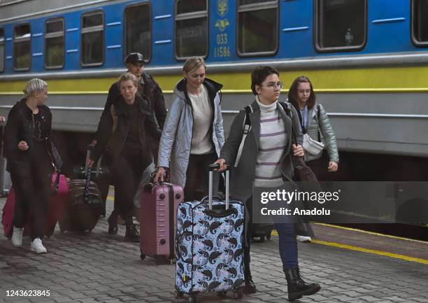 People, arriving from Ukraine by train, are seen at the railway station after the annexation of 15 percent of regions of Ukraine, that could be...