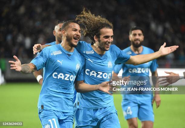 Marseille's Colombian forward Luis Suarez celebrates after scoring a goal with Marseille's French midfielder Matteo Guendouzi during the French L1...