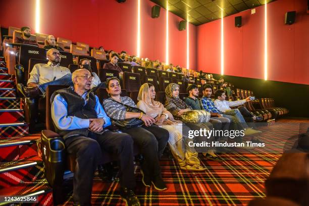 Members of the media and other guests watch the first show of a Bollywood movie Vikram Vedha inside Kashmirs first-ever multiplex 'INOX' on September...