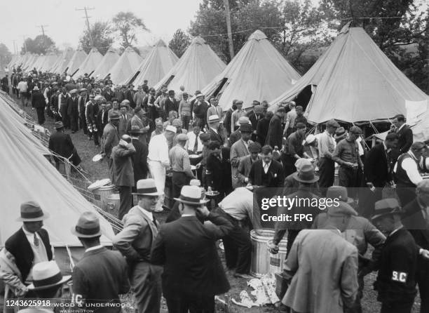 The Bonus Army, a demonstration largely made up of World War I veterans and their families, lines up at the mess tent at their camp in Fort Hunt,...