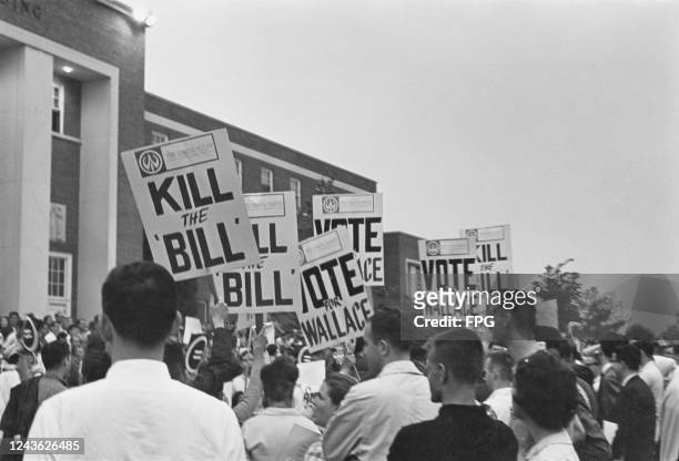 Members of The White Party Of America with placards reading 'Kill the Bill' and 'Vote for Wallace', in support of Alabama Governor George Wallace,...