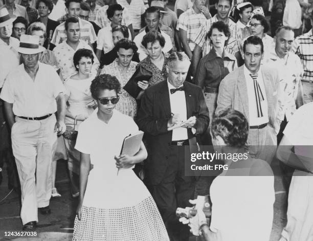 Year-old Elizabeth Eckford is followed by a sullen mob as she attends her first day at Little Rock Central High School in Little Rock, Arkansas, 4th...