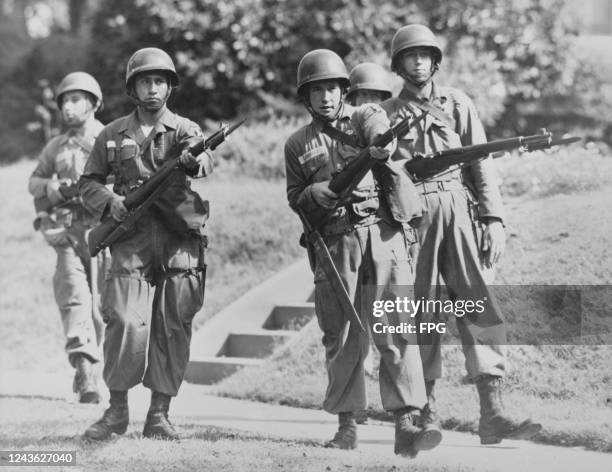 Paratroopers are called in to the Little Rock Central High School in Little Rock, Arkansas, after Governor Orval Faubus defied a decree by the US...
