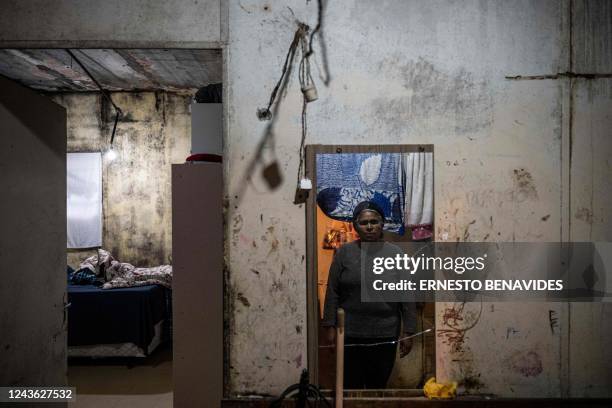 Ana Paula dos Santos poses for a picture at her home in Morro da Lua favela, in Sao Paulo, Brazil, on September 30, 2022. - Brazil entered the final...