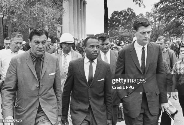 American activist James Meredith on his way to class at University of Mississippi, escorted by US Marshal James McShane, left, and John Doar of the...