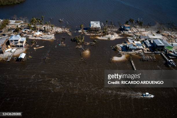 An aerial picture taken on September 30, 2022 shows the only access to the Matlacha neighborhood destroyed in the aftermath of Hurricane Ian in Fort...