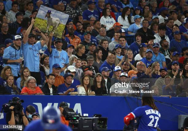Fans hold up a poster of a goat sporting Vladimir Guerrero Jr.s face as the Toronto Blue Jays play the Boston Red Sox at Rogers Centre in Toronto....