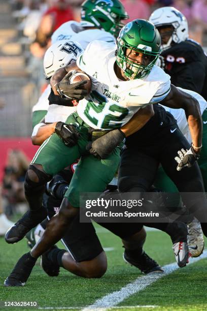 Tulane Green Wave running back Tyjae Spears attempts to break a tackle at the end of a first half rushing play during the football game between the...