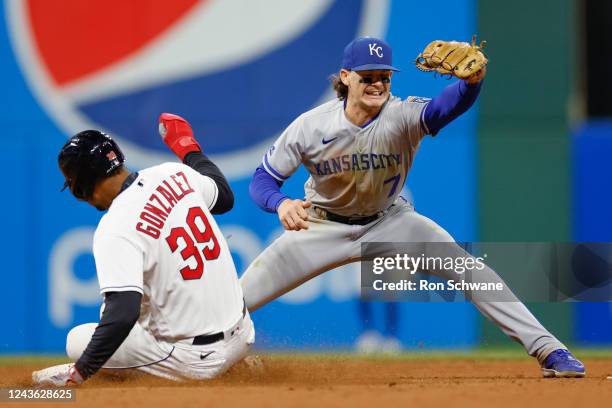 Bobby Witt Jr. #7 of the Kansas City Royals makes the catch for a force out on Oscar Gonzalez of the Cleveland Guardians at second base during the...