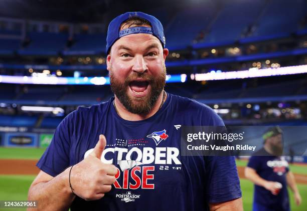 Manager John Schneider of the Toronto Blue Jays celebrates clinching a playoff spot after the win against the Boston Red Sox at Rogers Centre on...