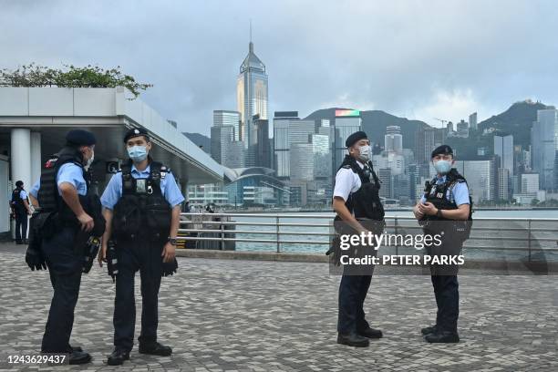 Police keep watch in Hong Kong on October 1 during commemorations for China's National Day.