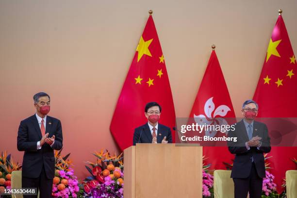 John Lee, Hong Kong's chief executive, center, claps during a reception to celebrate National Day in Hong Kong, China, on Saturday, Oct. 1, 2022....